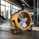 Portable drum fan improving warehouse airflow and summer cooling