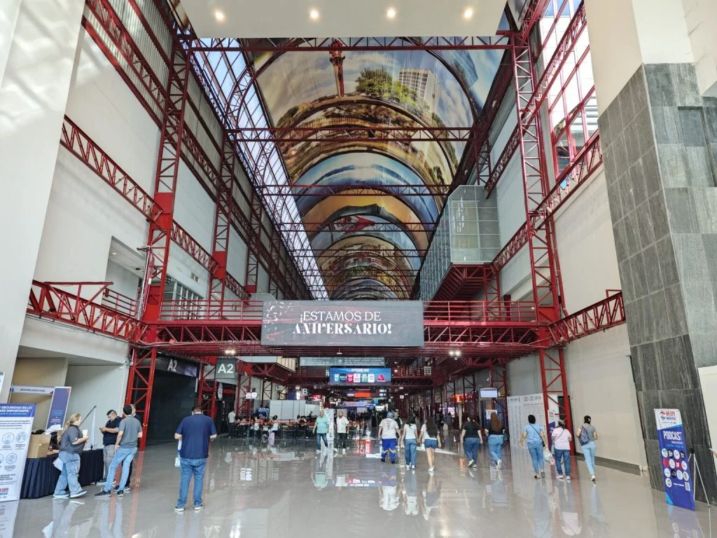 Unveiling Potential – Chic HVAC Group's Unforgettable Impact at AHR 2025 Mexico! 1 KCvents industrial exhibition hall with red steel framework and high ceiling artwork, showcasing a modern event space ideal for trade shows, conferences, and corporate gatherings.