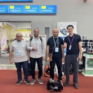 KCVENTS HVAC team with international customers at an exhibition booth